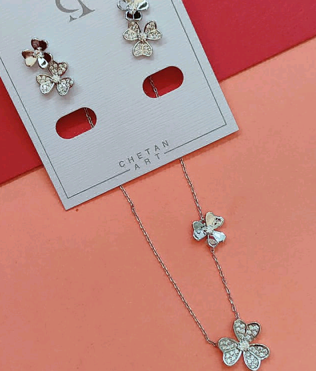 Silver CZ Flower Pendant With Dainty Flower In Chain